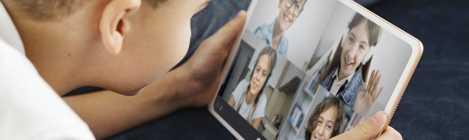 A boy on a group video call with other children during a Kidgency session